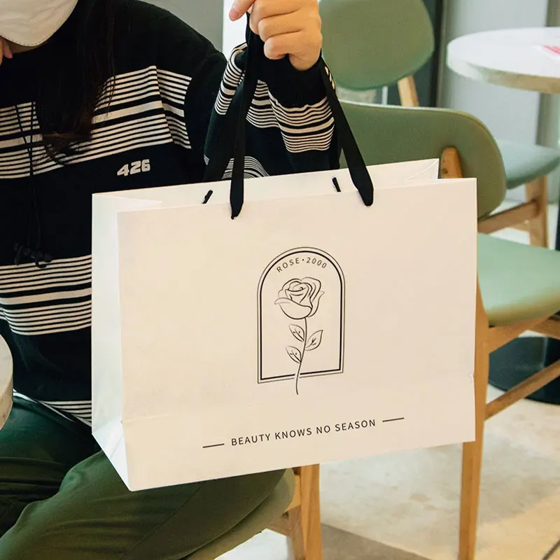 Bolsa de embalaje de compras de cartón blanco con asa de cinta de lujo personalizada, bolsas de papel impresas personalizadas con su propio logotipo, 10 Uds.